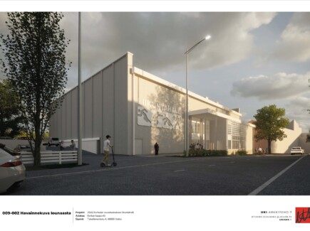 Havainnekuvassa vaaleansävyinen liikuntahallirakennus.